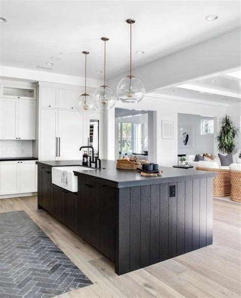 These 12 White Kitchens With Dark Islands Prove Contrast Is Key | Hunker | Black kitchen island ...