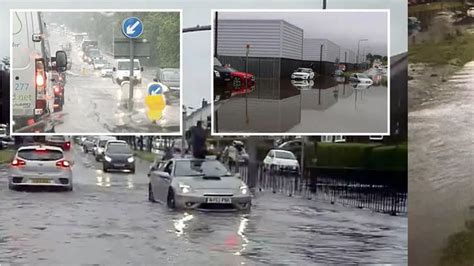 Edinburgh flooding chaos as tram evacuated and driver trapped on top of car - Daily Record