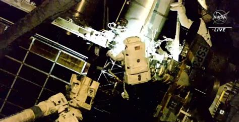 Spacewalking astronauts install an International Space Station roll-out ...