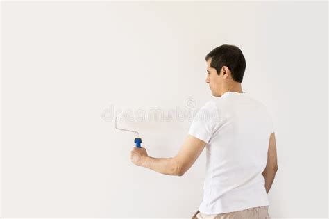 Painting the wall stock photo. Image of attractive, casual - 59542398