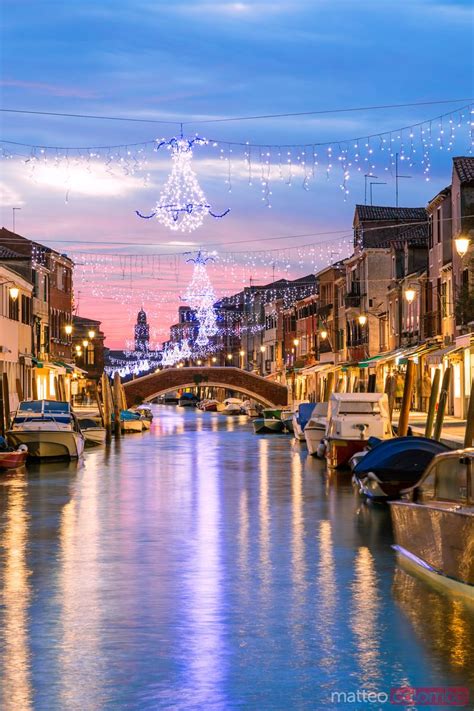 - Canal with Christmas lights at sunset, Burano, Venice | Royalty Free Image