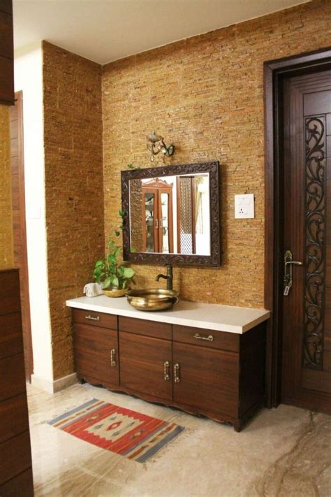 The perfect way to install wash basin in your dining area. The stone cladding tiles give the ...