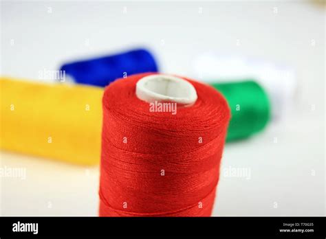 sewing thread in different colors Stock Photo - Alamy