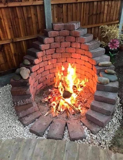 an outdoor fire pit made out of bricks