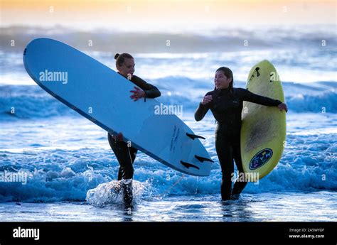 Surfers enjoy the waves at the beaches of La Serena, La Serena, Chile ...