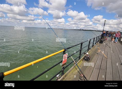 Fishing from Southend Pier, a major landmark in Southend. Extending 1.34 miles (2.16 km) into ...