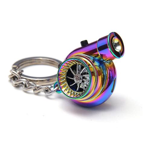 a multicolored key chain with a metal object on it's end and a clock in ...