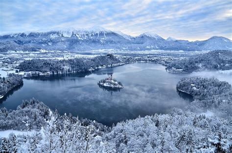 Photo Gallery: Lake Bled draped in winter white in the winter