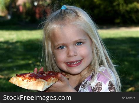 Sweet Little Girl Eating Pizza Slice - Free Stock Images & Photos ...