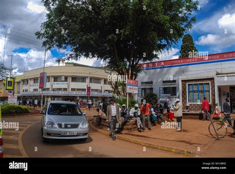 Thika Kenya November 7 2008. Typical street scene in Thika , Kenya.Cars and unidentified people ...