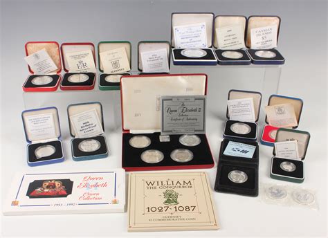 A collection of Royal Mint deluxe edition silver commemorative coins ...