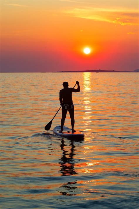 Stand up paddling stock image. Image of silhouette, leisure - 251636807