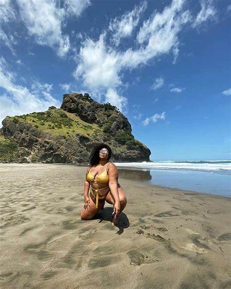 Lizzo Shows Off Curves in a Gold Cutout Swimsuit on the Beach