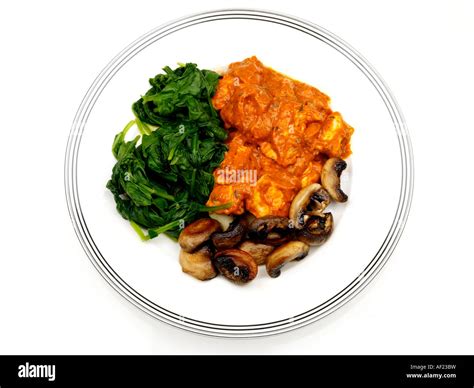 Chicken curry spinach mushrooms meal hi-res stock photography and ...