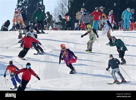 People enjoy skiing and snowboarding at Rokko Snow Park in Rokkosan ...