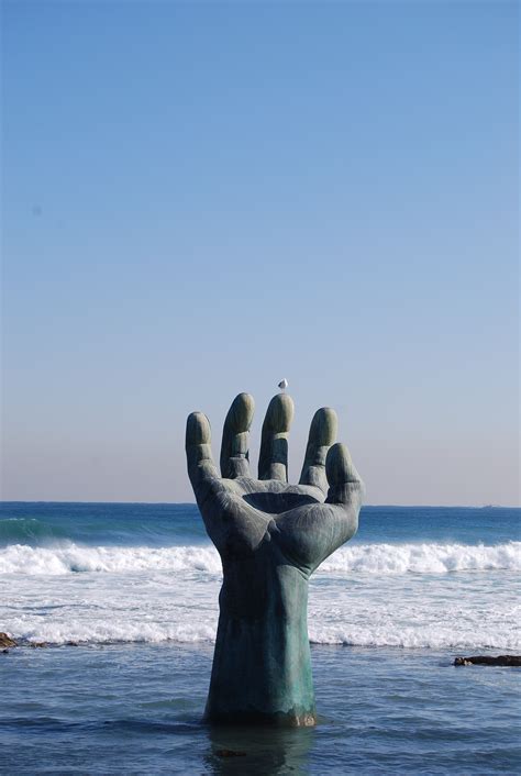 Free Images : hand, beach, sea, coast, sand, rock, ocean, horizon, wave, vacation, statue, blue ...