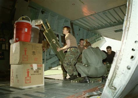 Members of the 86th Airlift Wing load relief supplies for the victims of the U.S. embassy bombings.