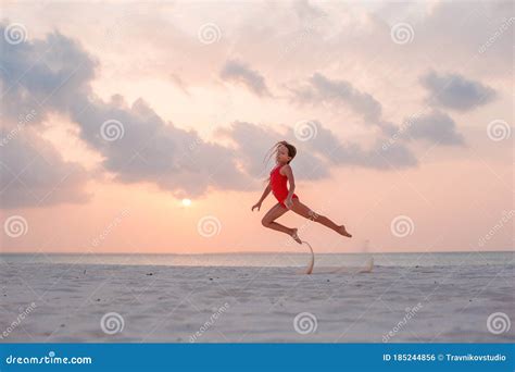 Adorable Happy Little Girl on White Beach at Sunset. Stock Photo - Image of expression, evening ...