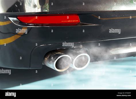 Car exhaust while leaving a smoke Stock Photo - Alamy