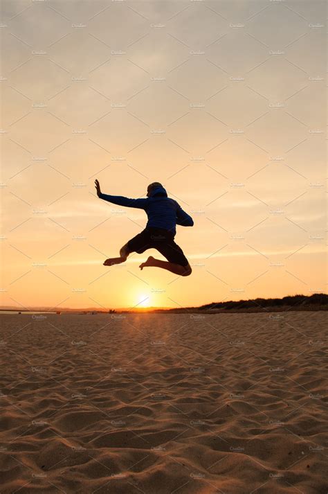 Man silhouette. Jumping at sunset | High-Quality People Images ~ Creative Market