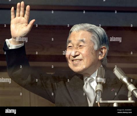 Japan's Emperor Akihito waves at a crowd of well-wishers during a morning appearance through the ...