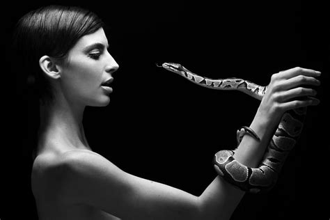 Black and White of Short Haired American Model and Actress, Rachele Schank with snake. Shot by ...
