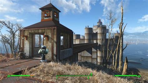 an old building sitting on top of a hill next to the ocean with green arrows pointing towards it