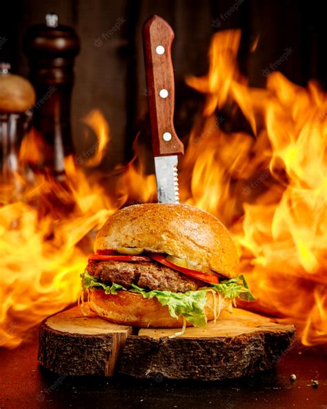 Free Photo | Fire meat burger on a wooden hemp