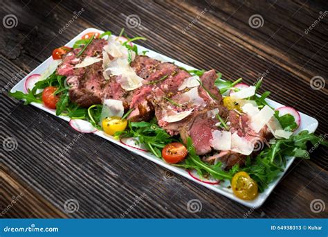 Beef Tagliata with Arugula stock image. Image of grill - 64938013