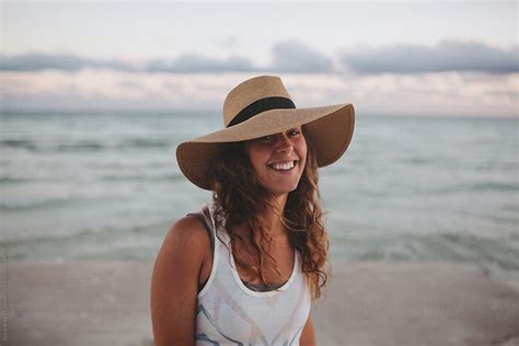 "Pretty Woman Laughing On The Beach During Summer Sunset" by Stocksy Contributor "Rob And Julia ...