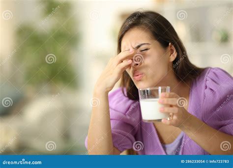 Woman Smelling Expired Milk at Home Stock Photo - Image of house ...