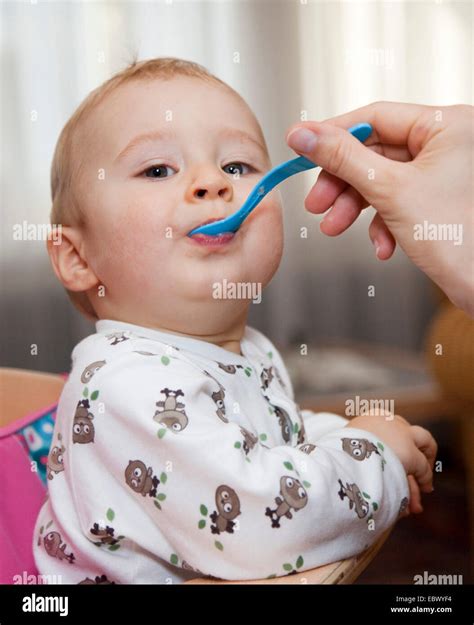 feeding a baby Stock Photo - Alamy