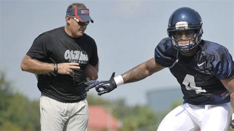 Ole Miss linebackers coach Tom Allen leads Denzel Nkemdiche through a ...