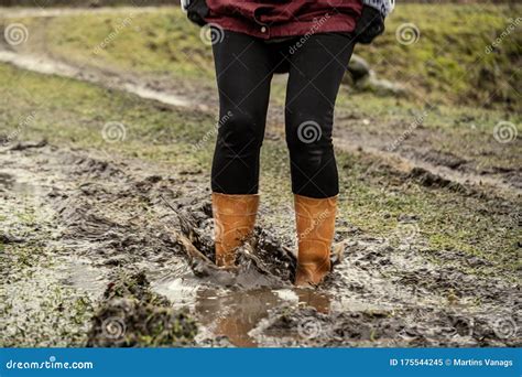 Woman Jumping in the Puddle of Mud Stock Image - Image of soil, walk: 175544245