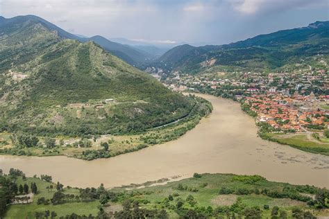 an aerial view of a river and mountains