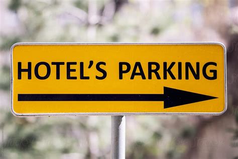 "Yellow Sign Hotel Parking Lot" by Stocksy Contributor "Igor Madjinca ...