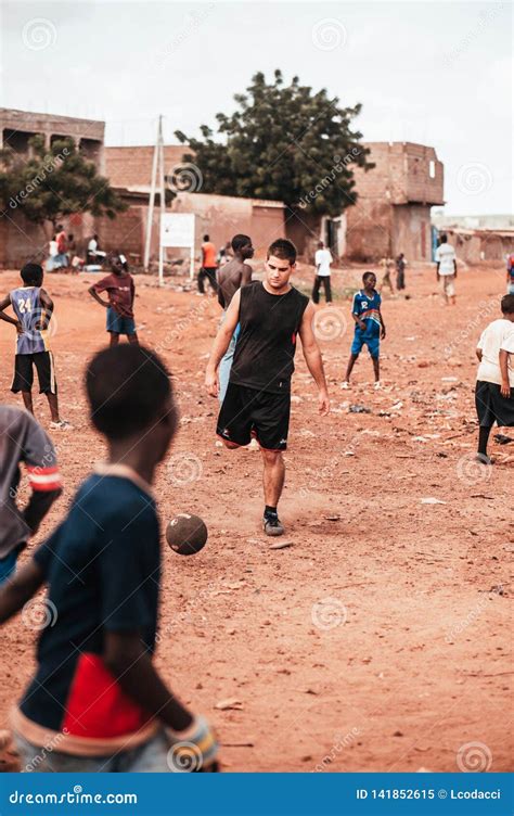 Black African Children Playing Soccer with Caucasian Volunteer Editorial Image - Image of friend ...