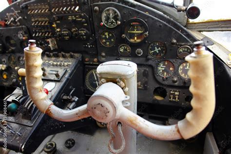 Inside the cockpit of the old plane. The steering wheel of the plane. Vintage airplane dashboard ...