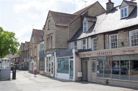 Shops on the High Street in Witney, Oxfordshire in the UK Editorial ...