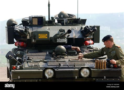 Tank driver and Scimitar tank at "The Armour Centre" at Bovington in Dorset Britain UK Stock ...