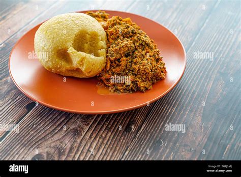 Nigerian Egusi Melon soup with garri eba for lunch Stock Photo - Alamy