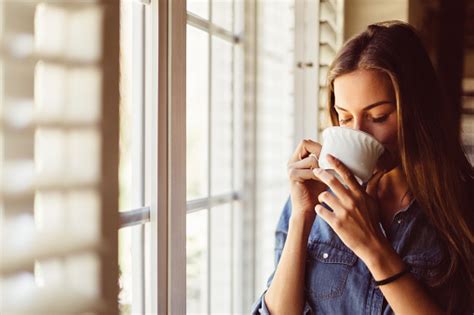 Woman Drinking Coffee Early In The Morning Stock Photo - Download Image Now - iStock