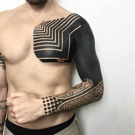 Neotribal style piece on chest and arm. | All black tattoos, Solid black tattoo, Black tattoos