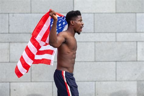 Premium Photo | African american man with usa flag protests and shouts ...