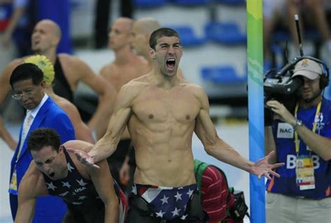 Michael Phelps celebrates after winning his 14th gold medal, setting the all-time record for ...