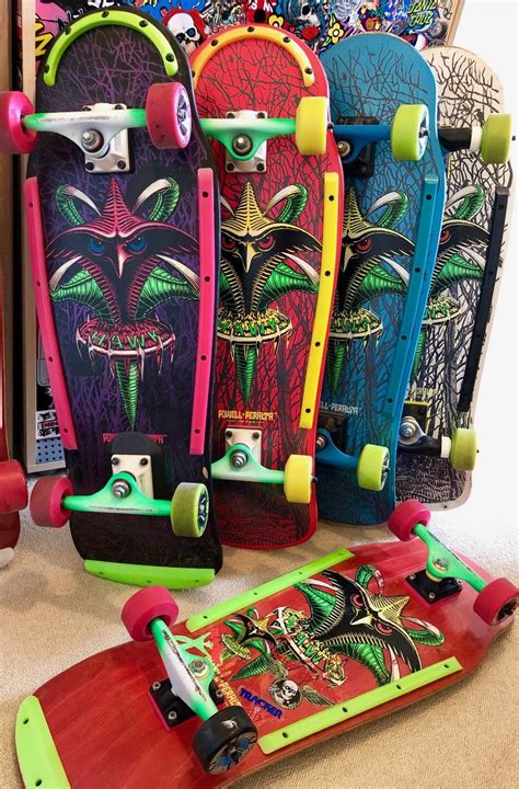 several skateboards are lined up on the floor in front of a pile of ...