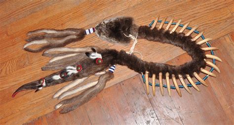 traditional style grizzly claw necklace, fully functional. Made from two otter skins, 11 ermine ...