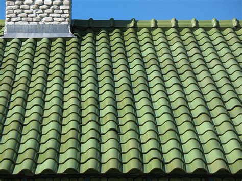 coolest green tile roof on brick house | Green roof house, Green tile ...