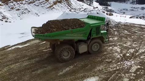 Giant electric dump truck runs on rocks and gravity