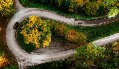 Zigzag Road, Framed by Orange Autumn Forest. Serpentine Climbs the ...